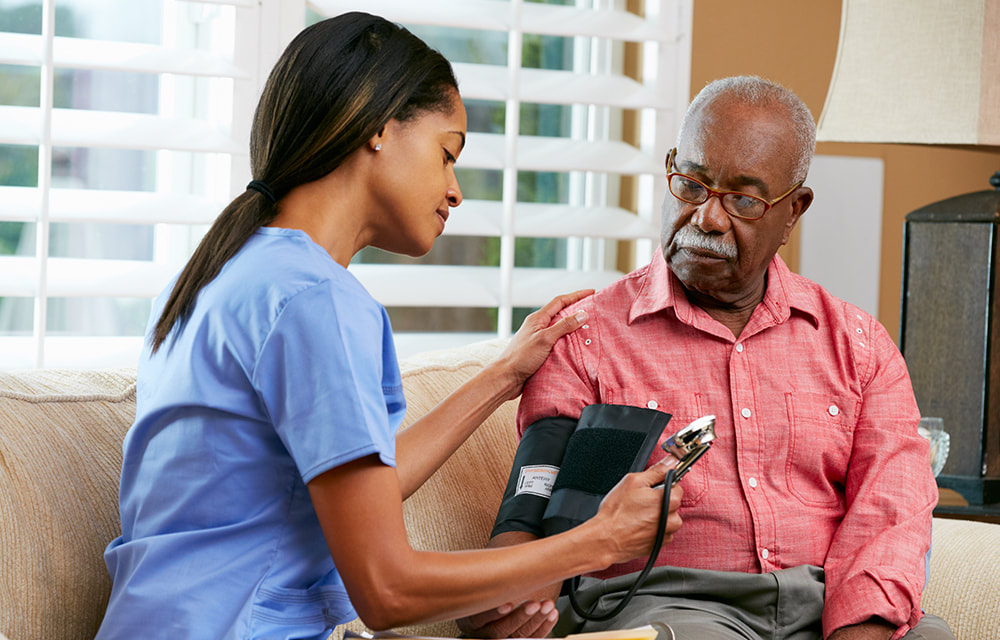 CHCA caregiver assisting an adult at home